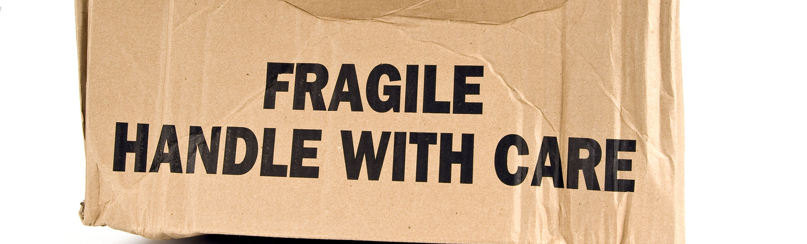 Damaged fragile brown cardboard box