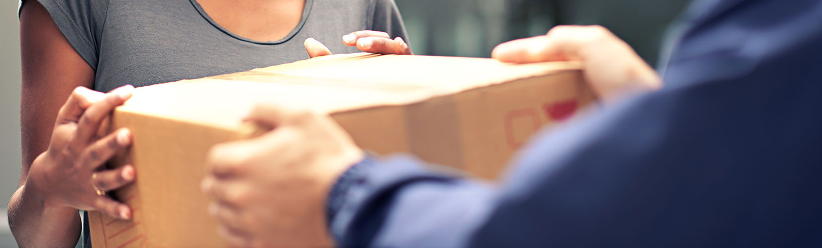 delivery man turning over package