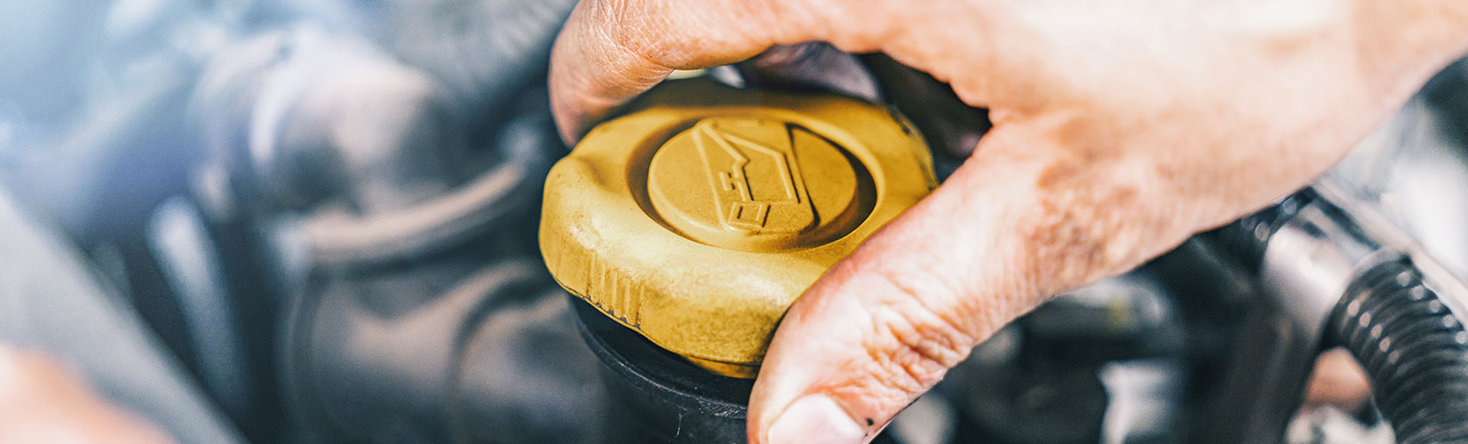 Close up of yellow engine oil cap