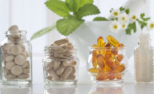 pills and capsules inside glass containers