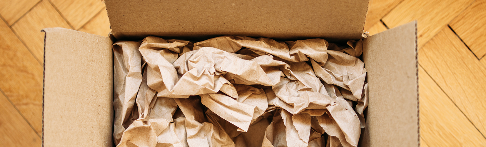 Paper Cushioning inside Brown Cardboard Box Packaging