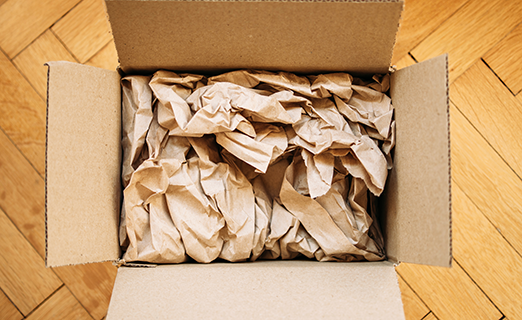 Paper Cushioning inside Brown Cardboard Box Packaging