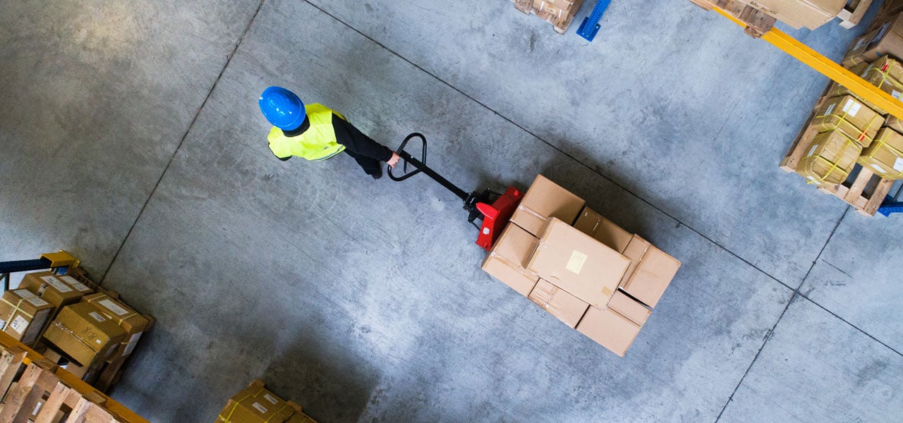 Top view of person pulling a carrier with multiple box packages