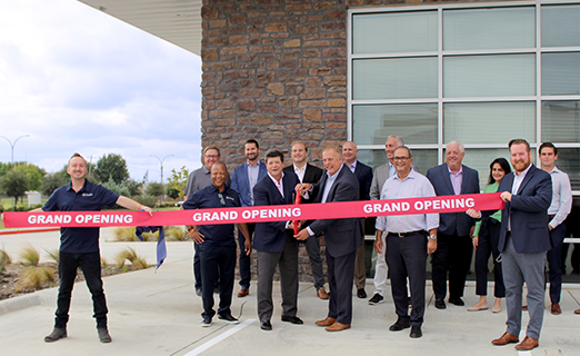 A grand opening ribbon cutting ceremony.