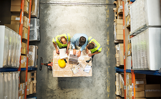 Workers' team meeting inside warehouse