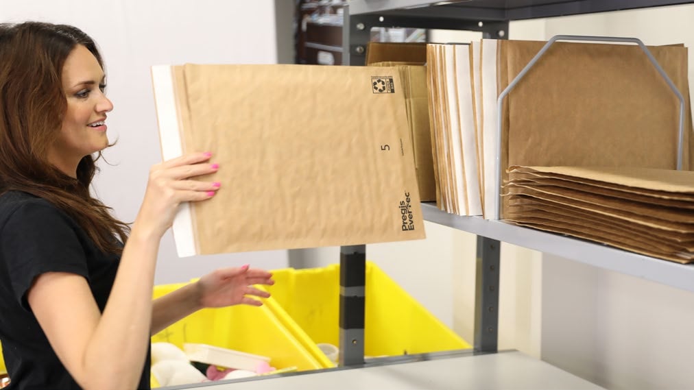 evertec mailers are being organized in a shelf