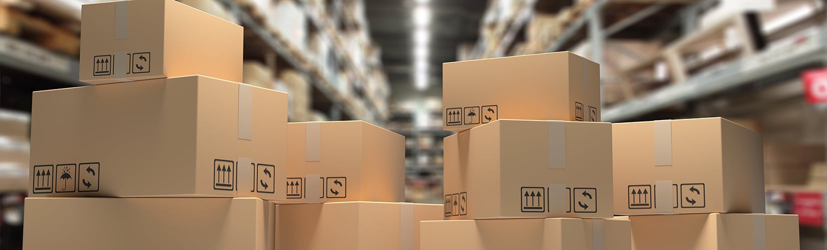 A pile of boxes is laid out inside a warehouse.