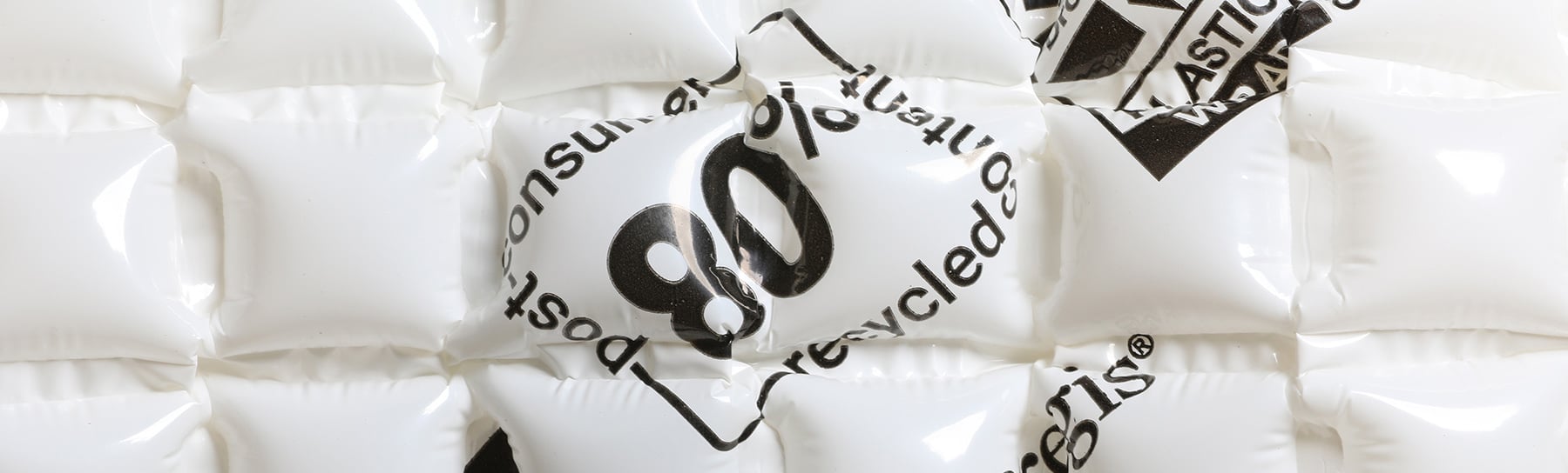 Close-up of inflated AirSpeed® HC Renew PCR made from 80% post-consumer recycled content, featuring printed text and a glossy surface.