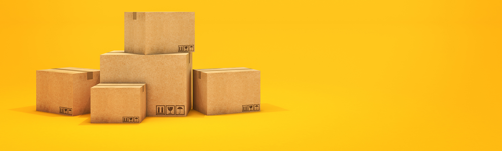 A pile of five cardboard boxes with yellow background