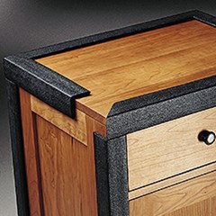 Foam Profiles are used to protect the corners of a wooden cabinet.