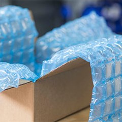 HC Inspyre blue film cushion inside cardboard box