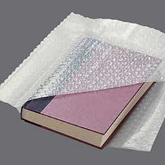 Cohesive bubble packaging material.