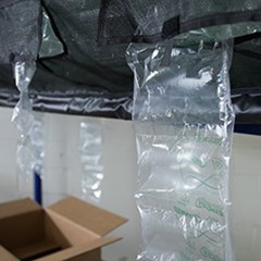 Air cushions being inflated by a machine.