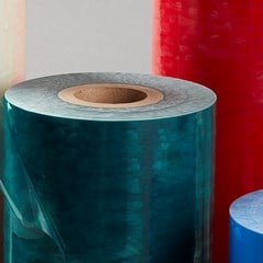 Rolls of differently colored surface protection films.