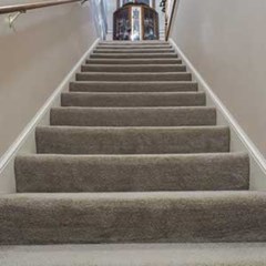 beige carpeted staircase