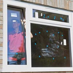 three panel glass window with white frame