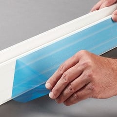 Blue surface protective film on vinyl window part.