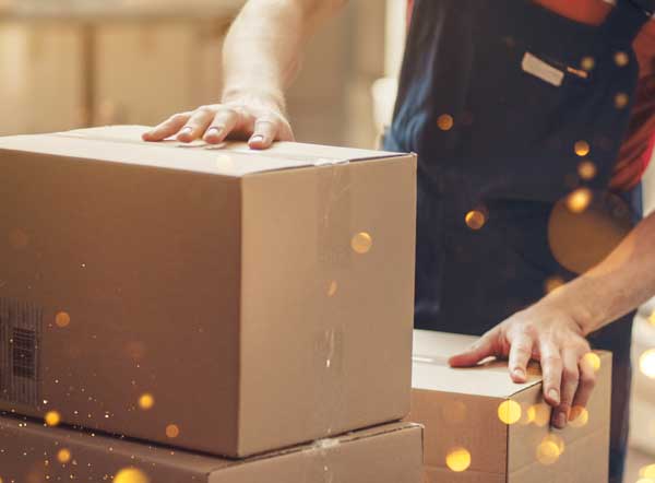 person inspecting box packages