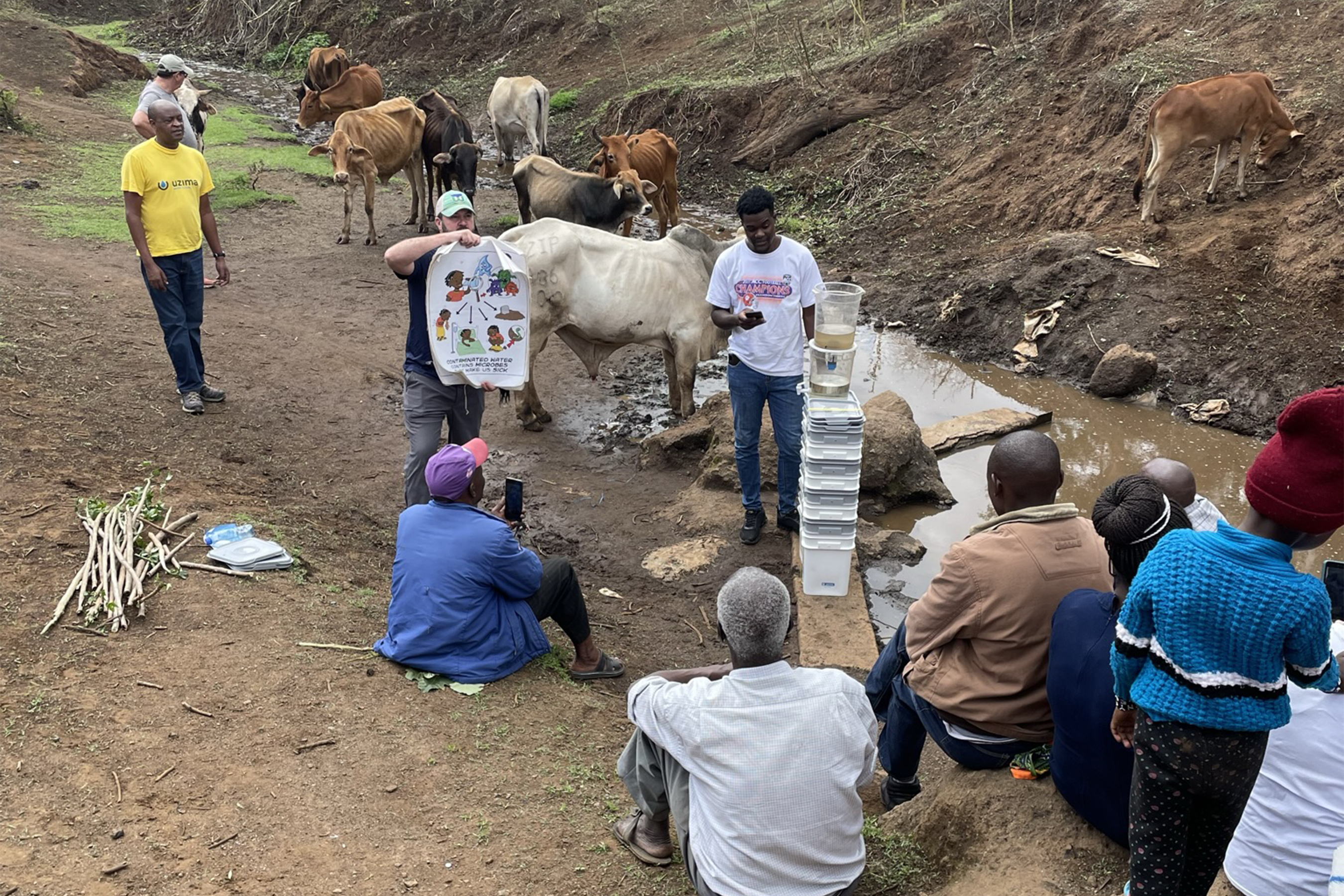 Uzima staff training locals on how to use Uzima filters.