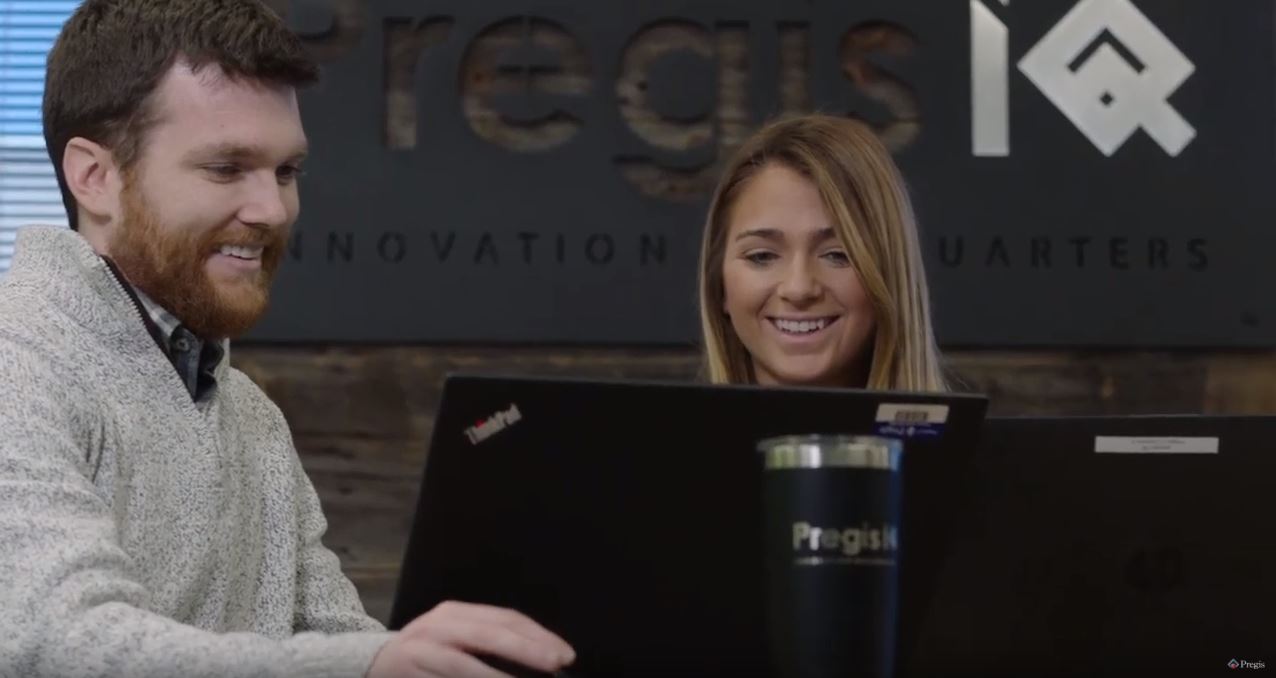 Two Pregis employees are working inside the Pregis' Innovation Headquarter (IQ)