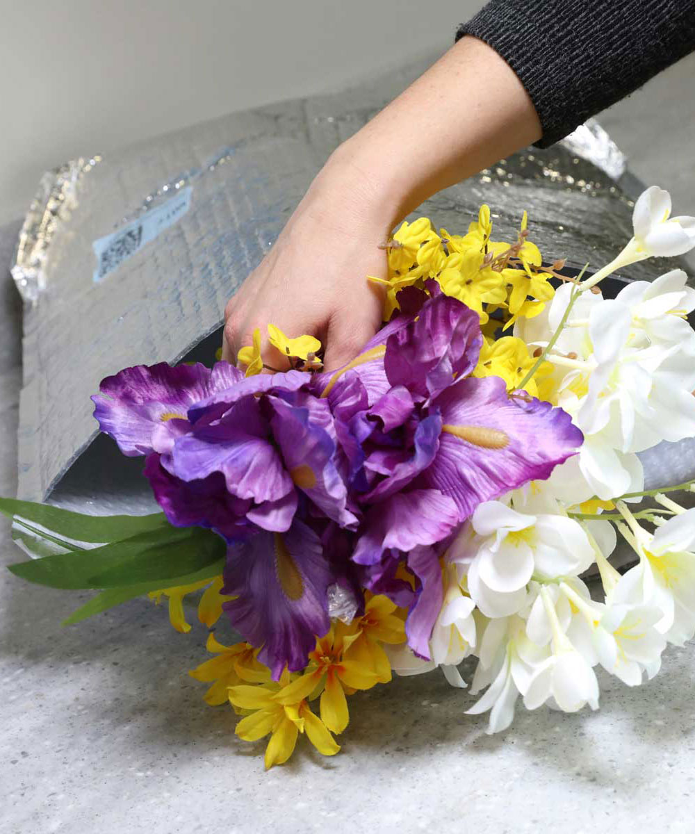 Flowers packed inside insulated packaging.