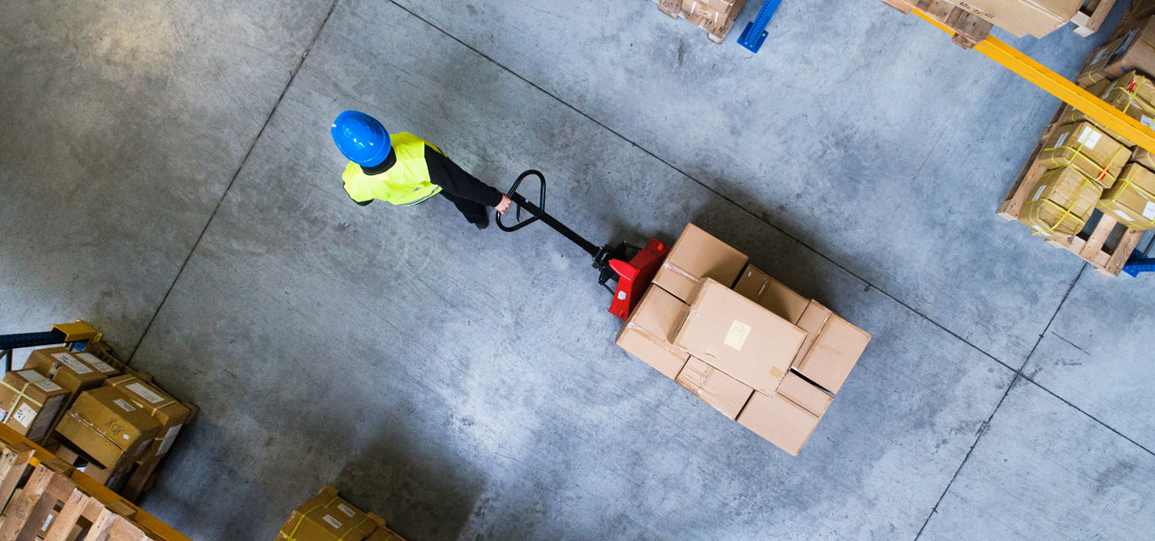 Top view of person pulling a carrier with multiple box packages
